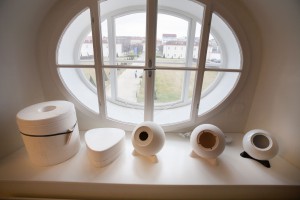 Two-piece mould and blank porcelain housings standing infront of a window at Augarten Vienna.